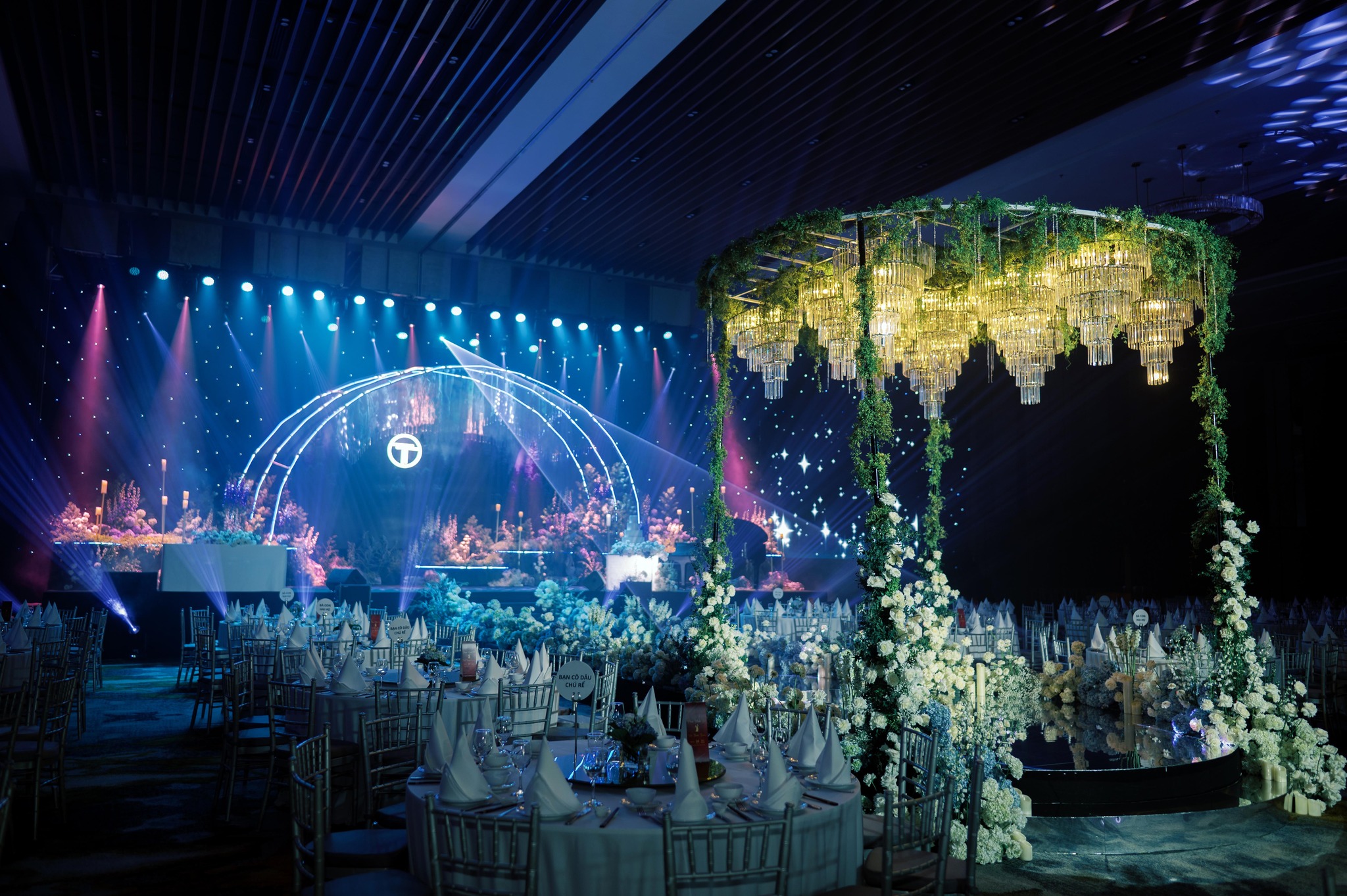 Luxurious wedding venue with elegant floral arrangements and ambient lighting.